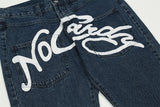 Ausgewaschene Baggy-Jeans für Herren mit Graffiti-Print